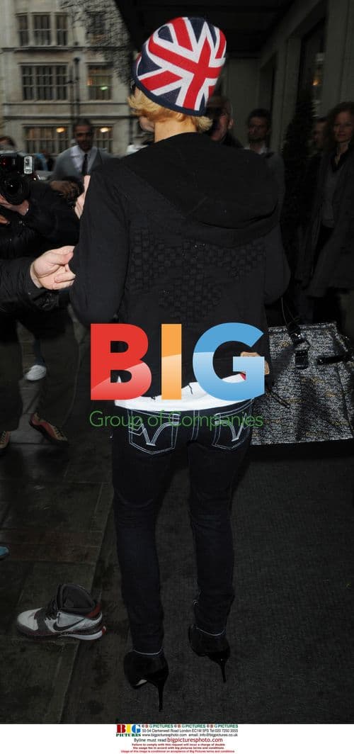 Paris Hilton and boyfriend Doug Reinhardt depart Heathrow