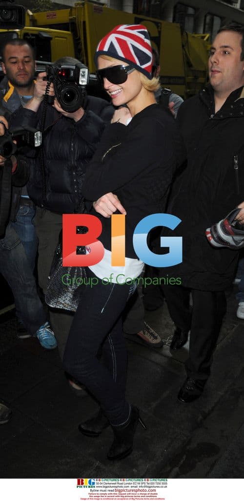 Paris Hilton and Doug Reinhardt depart Heathrow