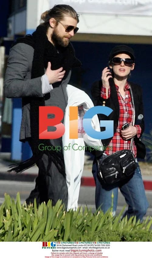 Winona Ryder shopping with male friend