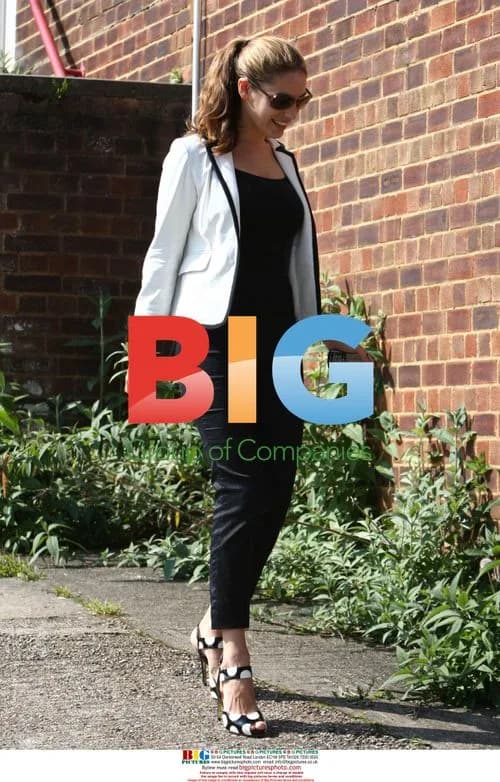 Kelly Brook arrives home with ring
