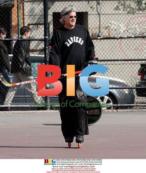 Tim Robbins playing street hockey