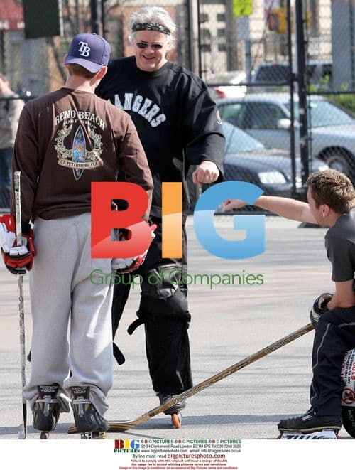 Tim Robbins plays street hockey in NYC