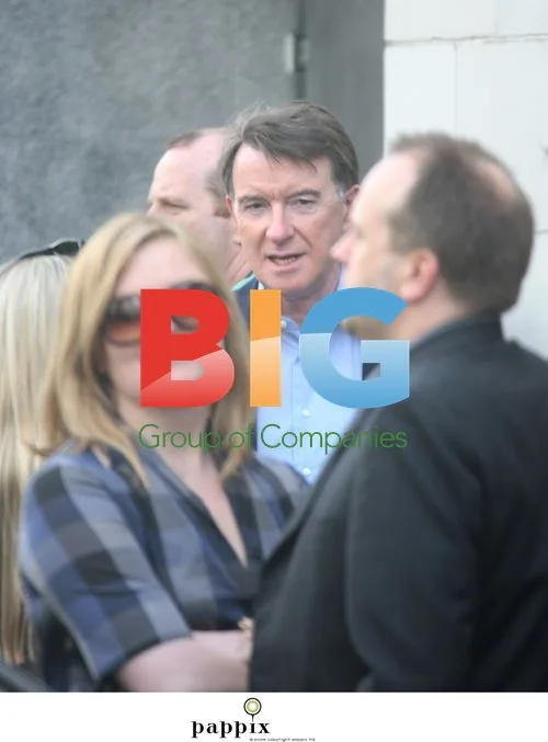 Peter Mandelson checks his phone in Notting Hill