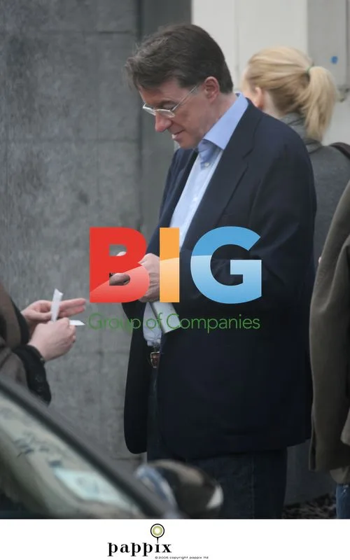 Peter Mandelson checks mobile in Notting Hill