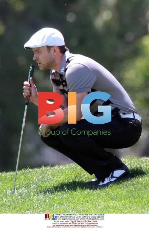 Justin Timberlake lines up golf shot