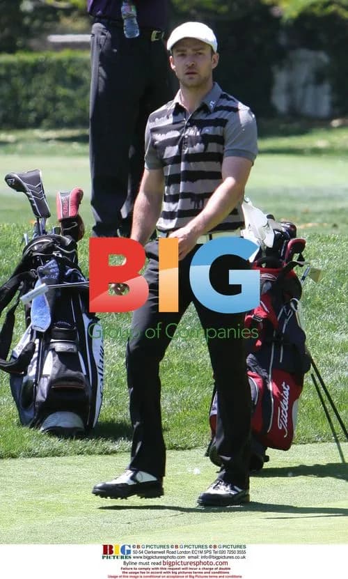 Justin Timberlake lining up golf shot