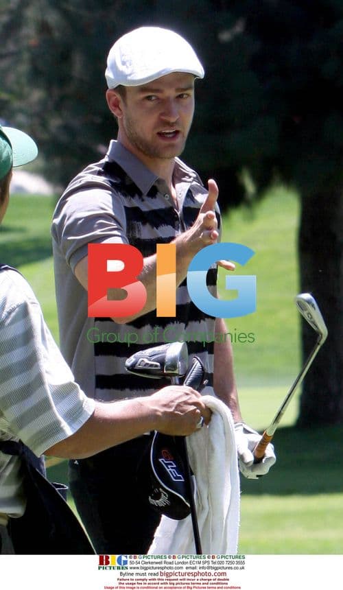 Justin Timberlake lining up golf shot