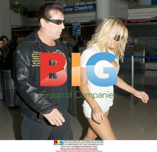 Pamela Anderson and Chuck Zito Arrive at LAX