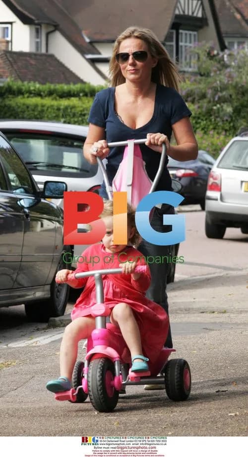 Geri Halliwell adjusts bra while out with daughter