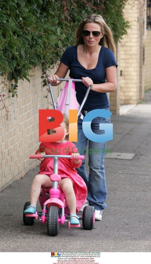Geri Halliwell Adjusts Bra on Walk with Daughter