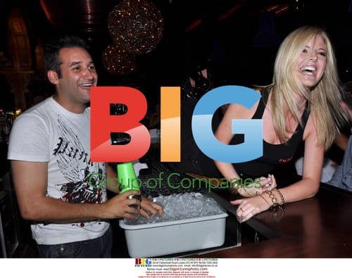 Singer Dane Bowers Poses as Cocktail Waiter