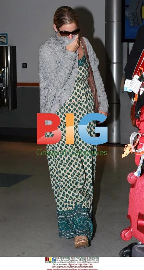 Christina Applegate arrives at LAX, covers face