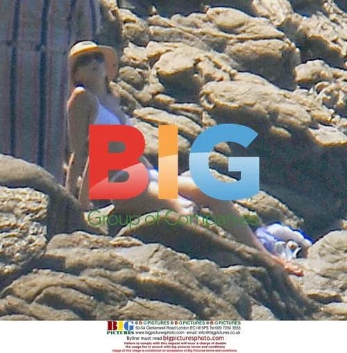 Sarkozy Climbs Rocks and Swims in France