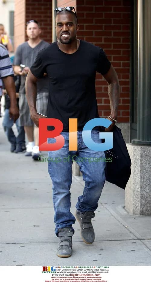 Kanye West chats with friend outside Jamba Juice