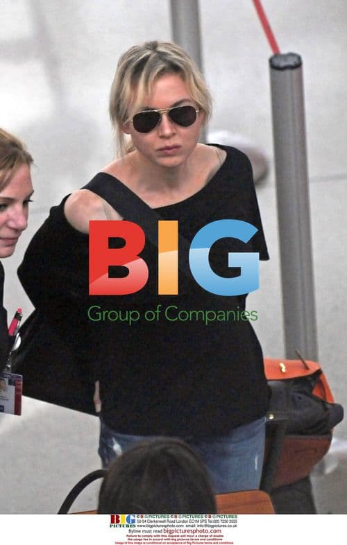 Renee Zellweger and Bradley Cooper at JFK Airport