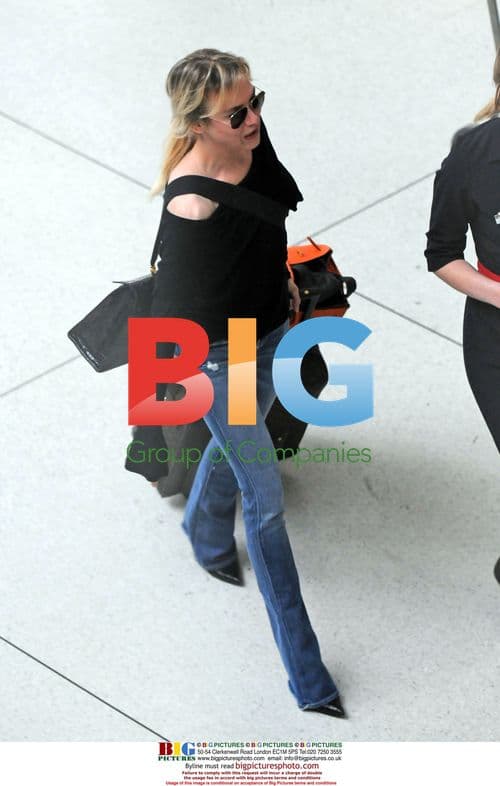 Renee Zellweger and Bradley Cooper Arrive at JFK