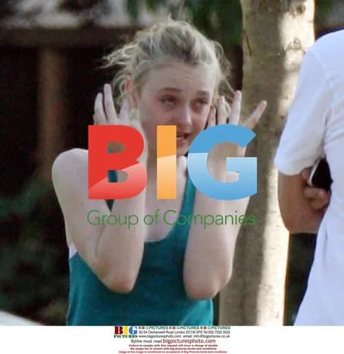 Dakota Fanning jogs with her dad