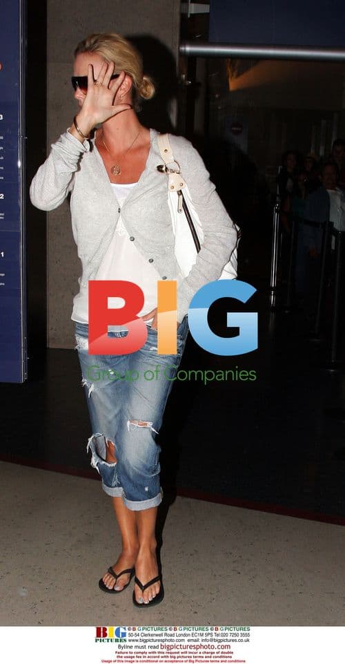 Charlize Theron with husband and mom at LAX