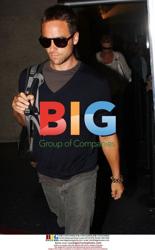 Charlize Theron arrives at LAX with husband and mom