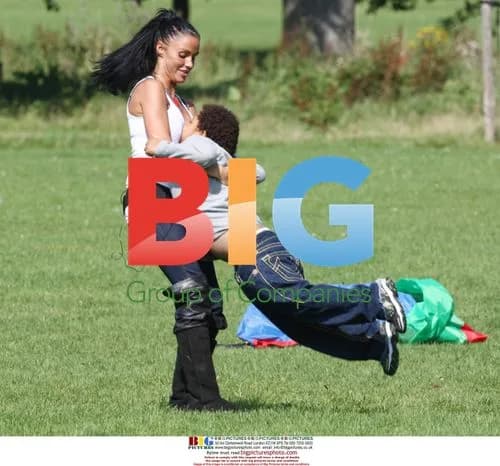 Katie Price and Alex Reid play football with sons