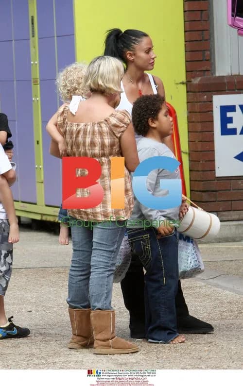 Katie Price and Alex Reid play football with sons