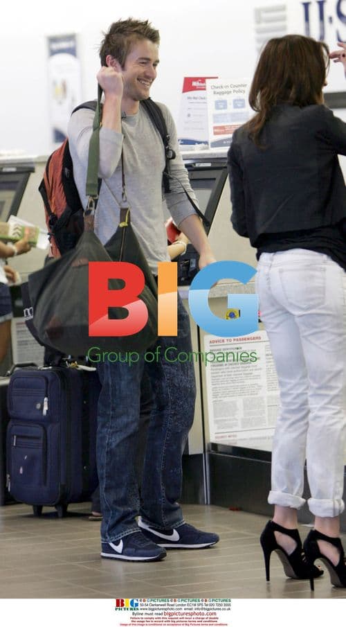 Robert Buckley and girlfriend departing LAX