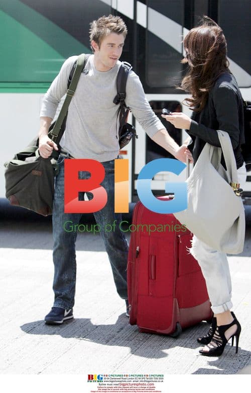Robert Buckley and girlfriend depart LAX