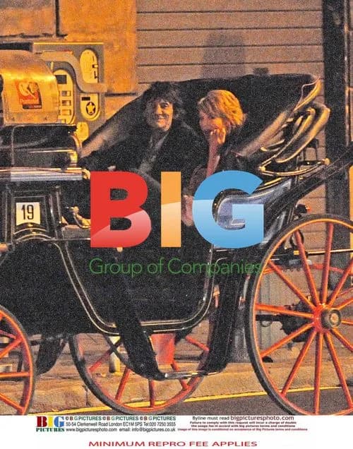 Ronnie Wood and Ekaterina Ivanova on a carriage ride in Rome