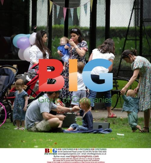 Kirstie Allsopp with family in park, 2009