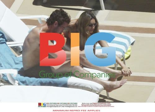Kelly Brook and Danny Cipriani Poolside
