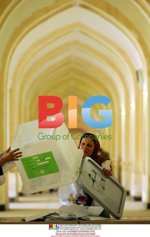 Woman counts ballots after Afghan election