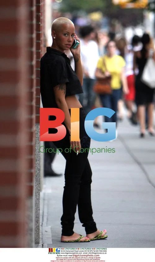 Amber Rose takes a cigarette break