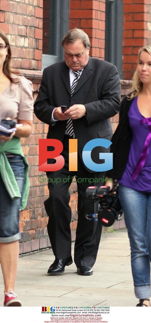 MP John Prescott on mobile in Manchester