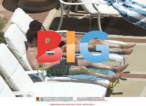 Kelly Brook and Danny Cipriani Poolside