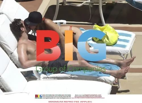 Kelly Brook and Danny Cipriani Poolside