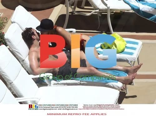 Kelly Brook and Danny Cipriani Poolside
