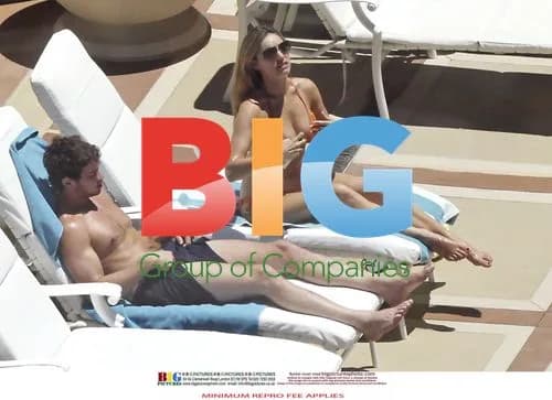 Kelly Brook and Danny Cipriani Poolside