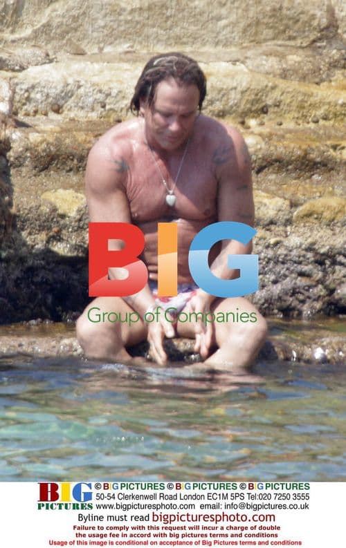 Mickey Rourke splashes in Croatia with female friend