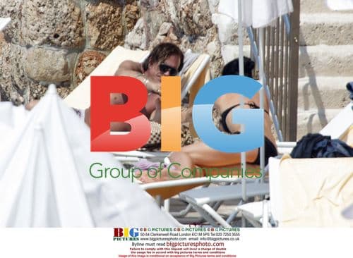 Mickey Rourke and female friend at beach in Croatia