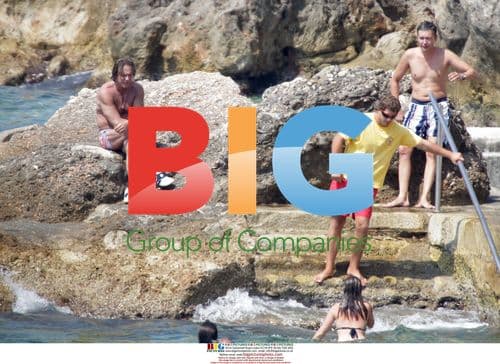 Mickey Rourke relaxes on beach with mystery friend