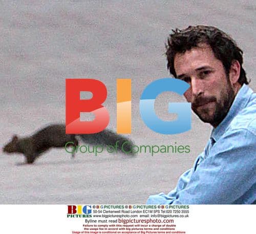 Noah Wyle taking coffee break on set