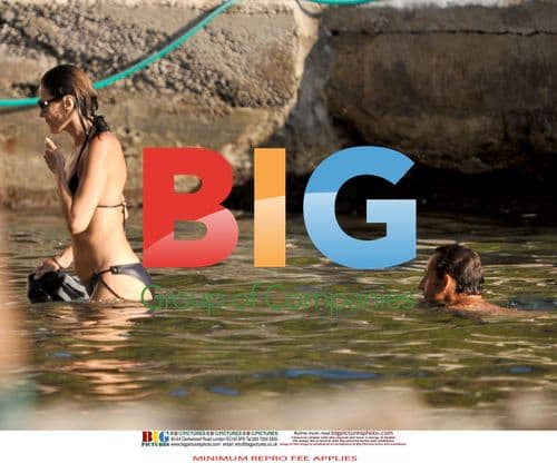 Sarkozy and Bruni Swim at French Home