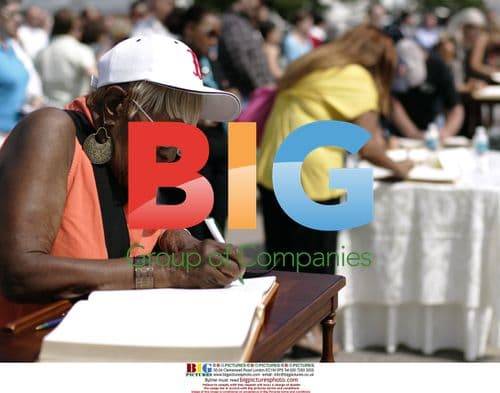 Mourner signs condolence book for Senator Kennedy