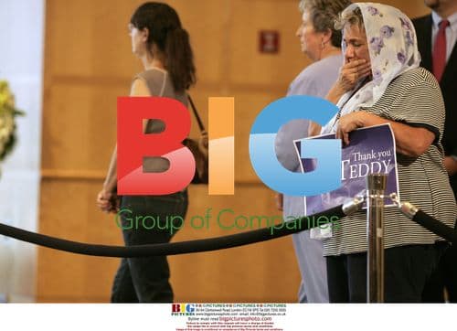 Woman reacts to Kennedy's casket