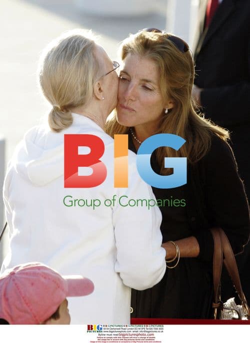 Caroline Kennedy receives hug at Kennedy wake