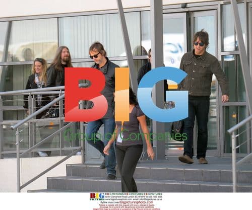 Oasis Members Depart Hotel for Canceled Paris Show