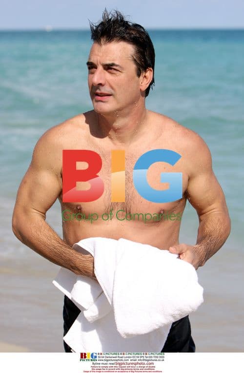 Chris Noth spotted swimming on Miami Beach