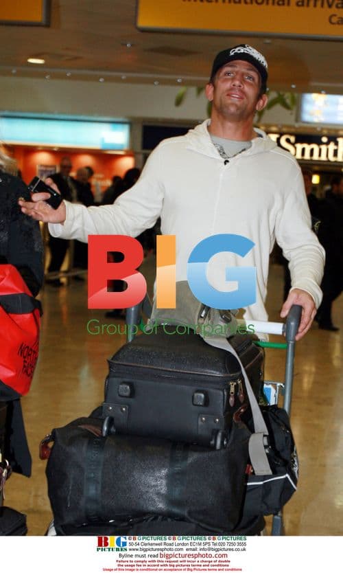 Alex Reid arrives in London from LA