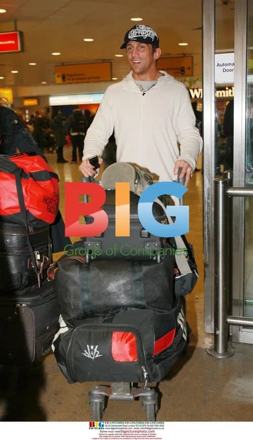 Alex Reid arrives in London from LA