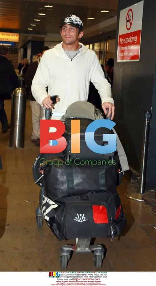 Alex Reid arrives in London from LA